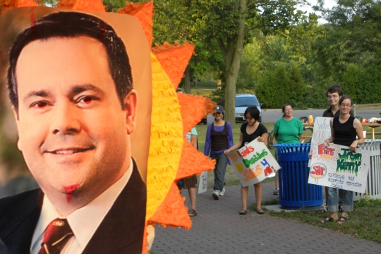 A pinata is hung at a protest against a visit by Immigration Minister Jason Kenney. 